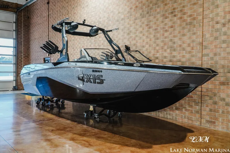 Slide: The Image of 2026 Axis A245 boat displayed indoors at Lake Norman Marina. - 3