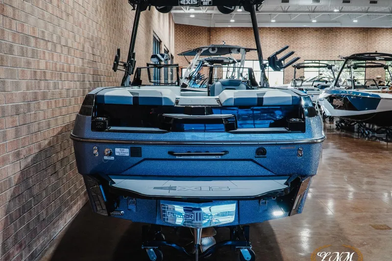 Slide: The Image of 2026 Axis A245 boat displayed indoors, showcasing sleek design and modern features. - 8