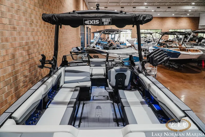Slide: The Image of 2026 Axis A245 boat interior at Lake Norman Marina showroom. - 9
