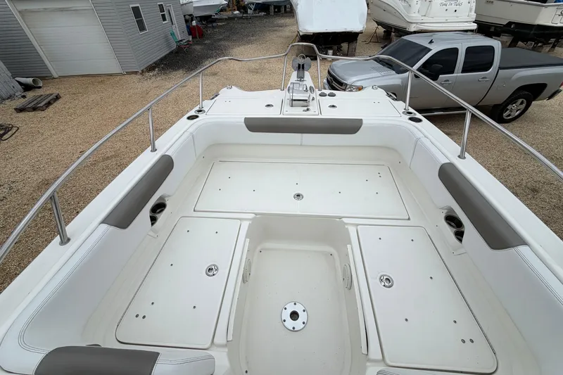 Slide: The Image of 2019 World Cat 255 DC boat interior with spacious seating and storage compartments. - 17