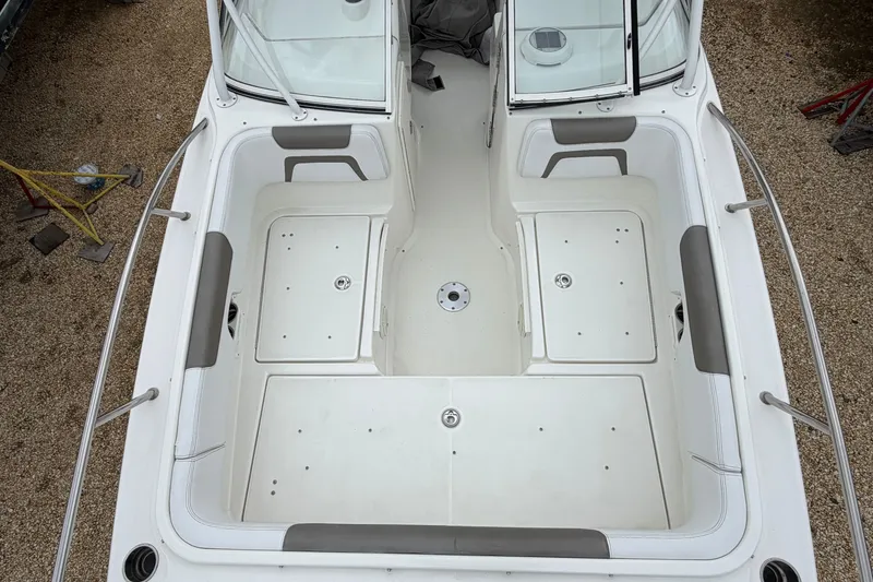 Slide: The Image of 2019 World Cat 255 DC boat interior, featuring spacious seating and storage compartments. - 18