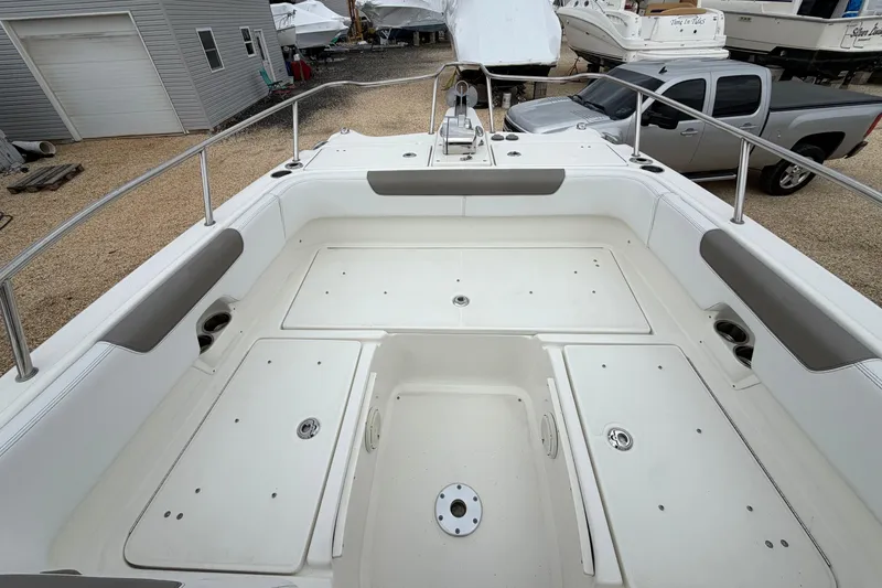 Slide: The Image of 2019 World Cat 255 DC boat deck with storage compartments and seating. - 19