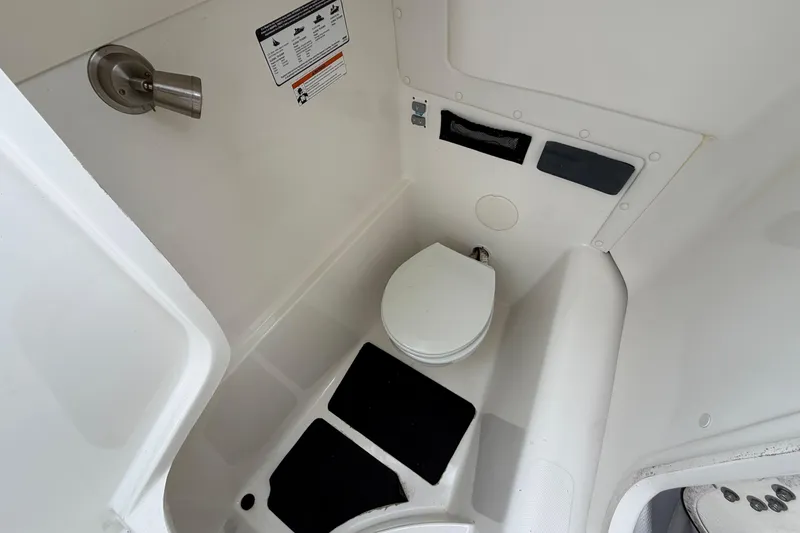 Slide: The Image of 2019 World Cat 255 DC boat interior with compact marine toilet. - 20