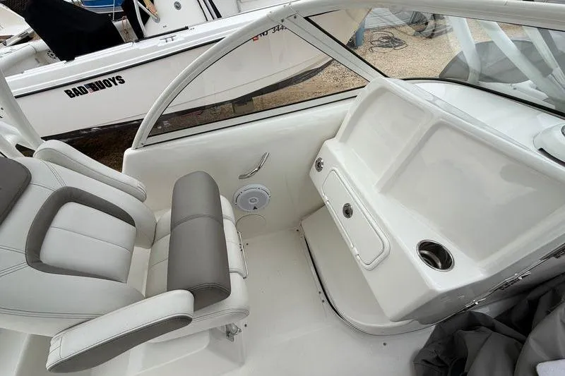 Slide: The Image of 2019 World Cat 255 DC boat interior with seating and storage compartments. - 22