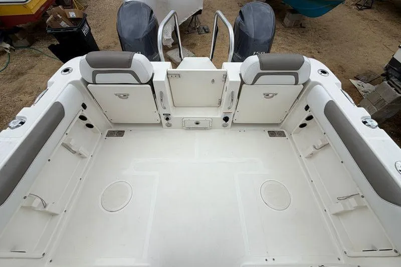 Slide: The Image of 2019 World Cat 255 DC boat interior with spacious seating and dual engines. - 6