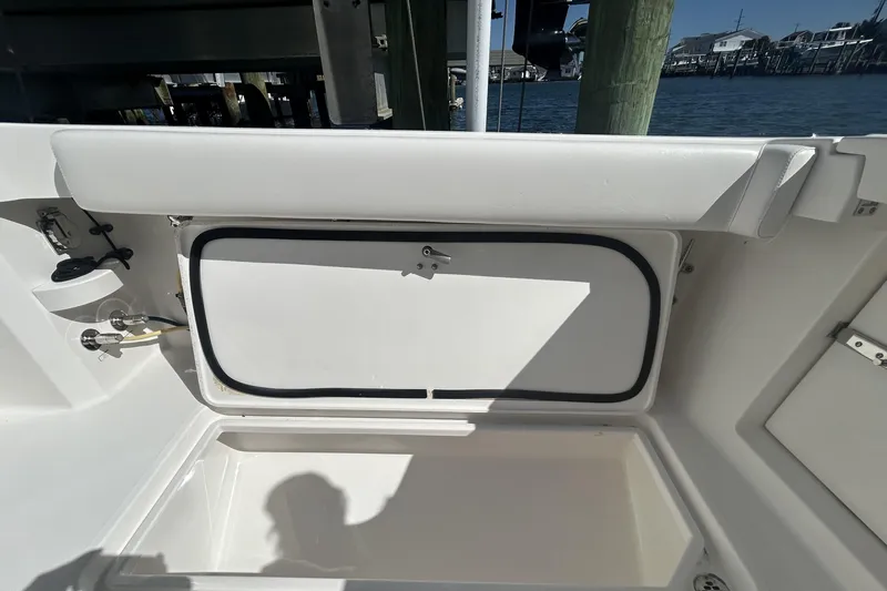 Slide: The Image of 2018 Albemarle 29 Express boat interior storage compartment with open hatch. - 10