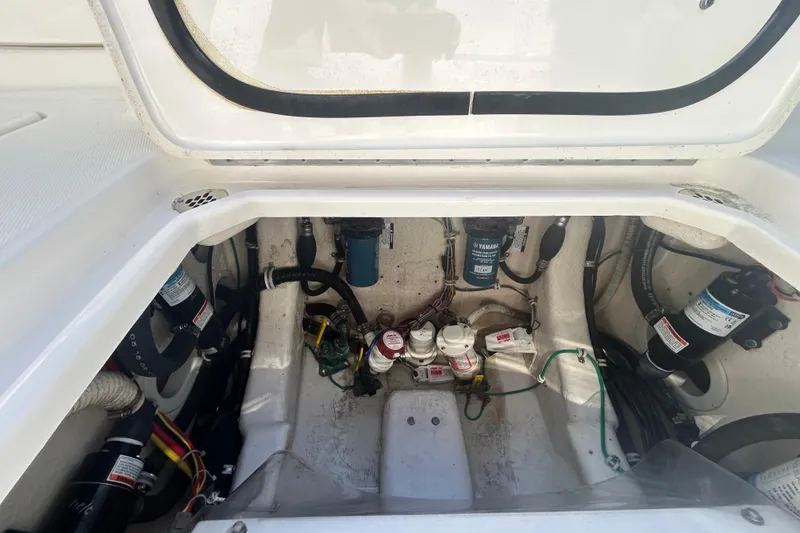 Slide: The Image of Engine compartment of a 2018 Albemarle 29 Express boat, showcasing mechanical components. - 14