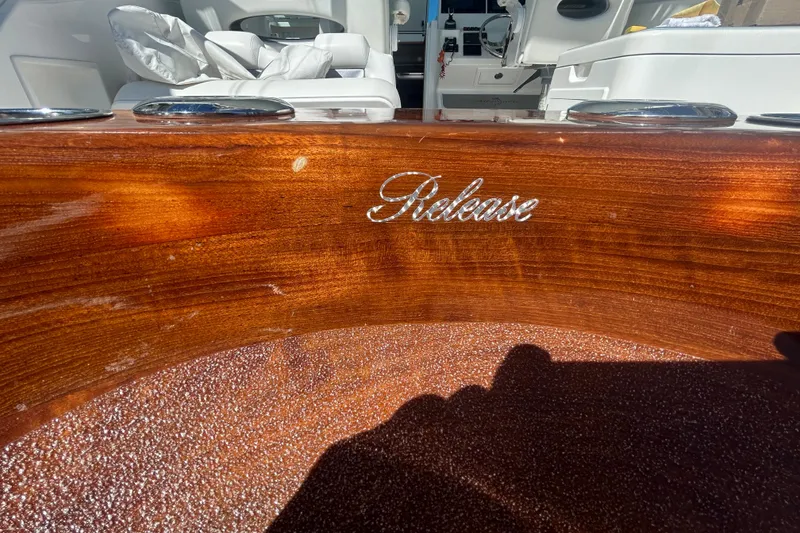 Slide: The Image of Polished wood interior of 2018 Albemarle 29 Express boat with "Release" logo. - 19