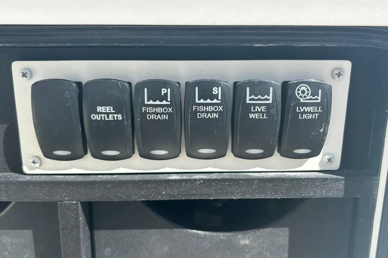 Slide: The Image of Control panel on a 2018 Albemarle 29 Express boat with labeled switches. - 26