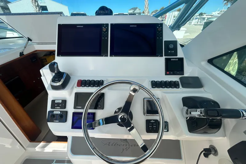 Slide: The Image of Helm of 2018 Albemarle 29 Express boat with dual Simrad displays and controls. - 35