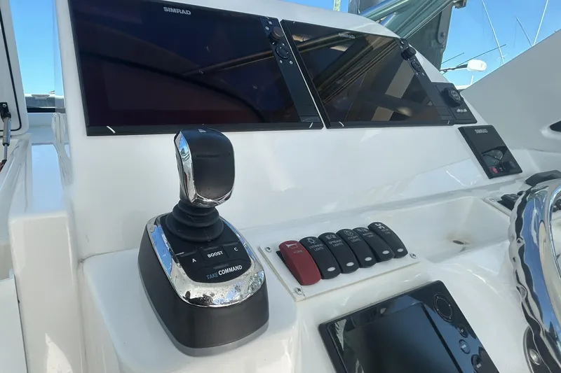 Slide: The Image of Control panel of 2018 Albemarle 29 Express boat with Simrad displays and joystick. - 36