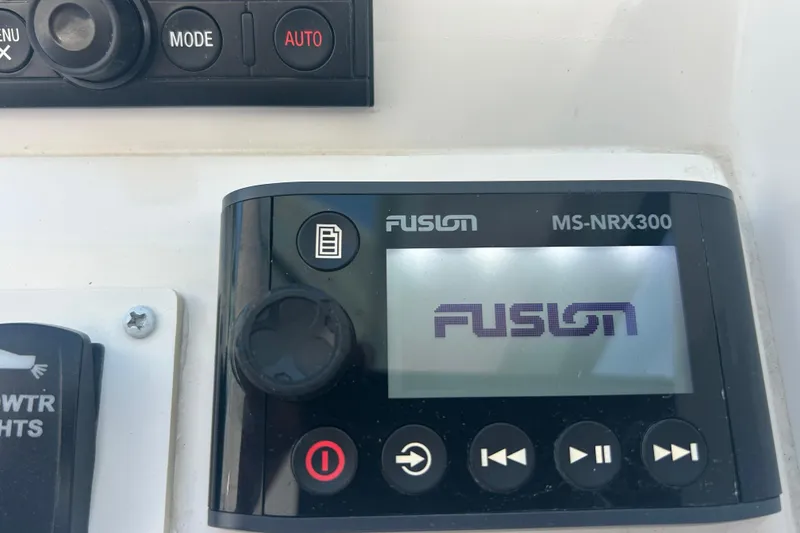 Slide: The Image of Fusion MS-NRX300 marine stereo control on 2018 Albemarle 29 Express boat dashboard. - 41