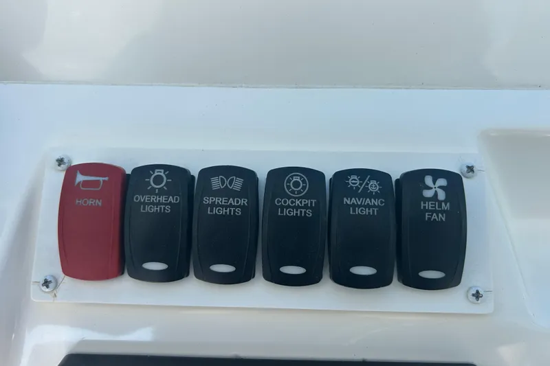 Slide: The Image of Control panel of a 2018 Albemarle 29 Express boat with labeled switches. - 42