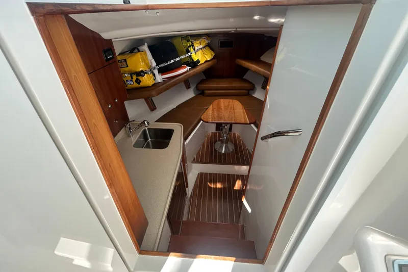 Slide: The Image of Interior of 2018 Albemarle 29 Express boat with kitchenette and seating area. - 47