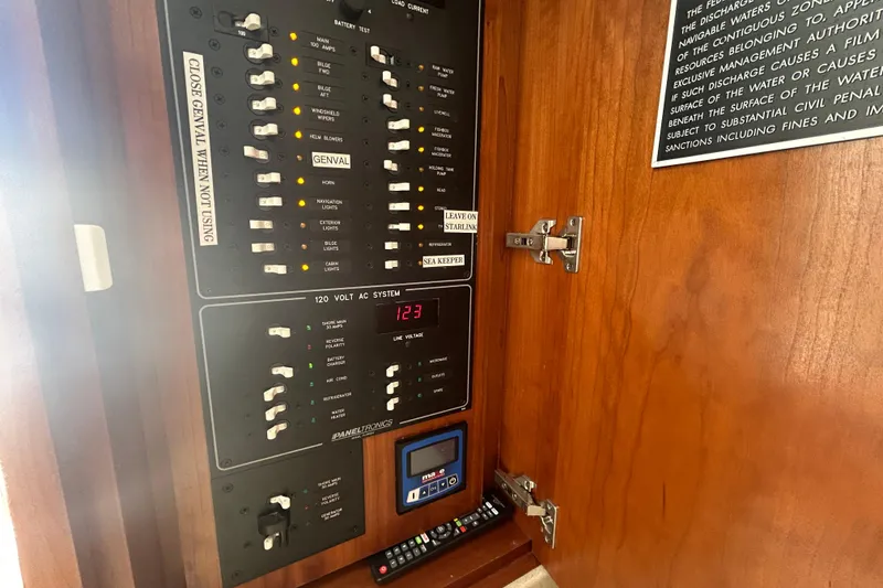 Slide: The Image of Electrical panel inside 2018 Albemarle 29 Express boat, featuring various switches and controls. - 51