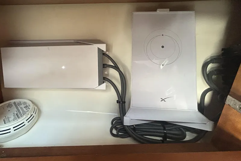 Slide: The Image of Electrical components and wiring inside a 2018 Albemarle 29 Express boat compartment. - 56