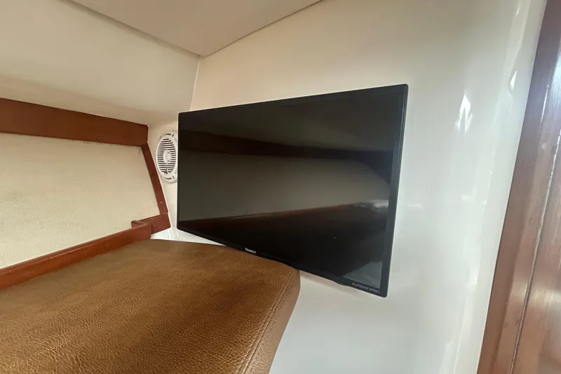 Slide: The Image of Interior of 2018 Albemarle 29 Express with mounted TV and speaker. - 57
