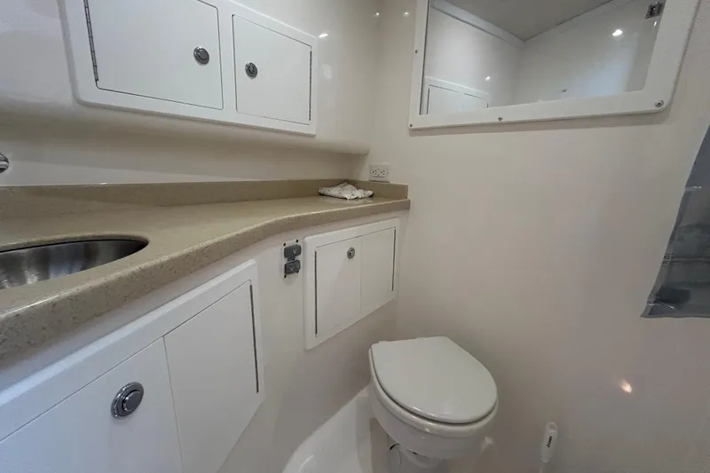 Slide: The Image of Bathroom interior of 2018 Albemarle 29 Express boat with sink and toilet. - 60