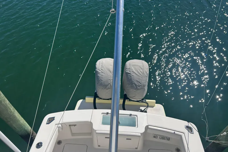Slide: The Image of 2018 Albemarle 29 Express boat docked, viewed from above, with sparkling water. - 62