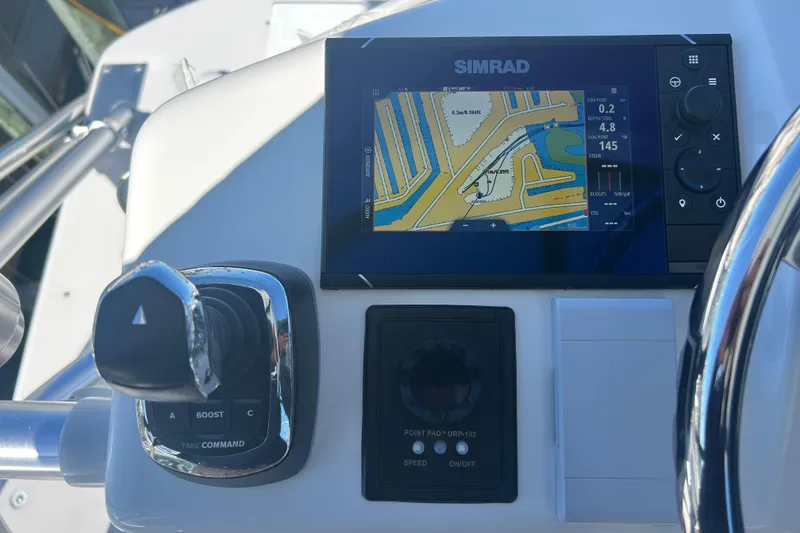 Slide: The Image of Control panel of a 2018 Albemarle 29 Express boat with Simrad navigation display. - 64