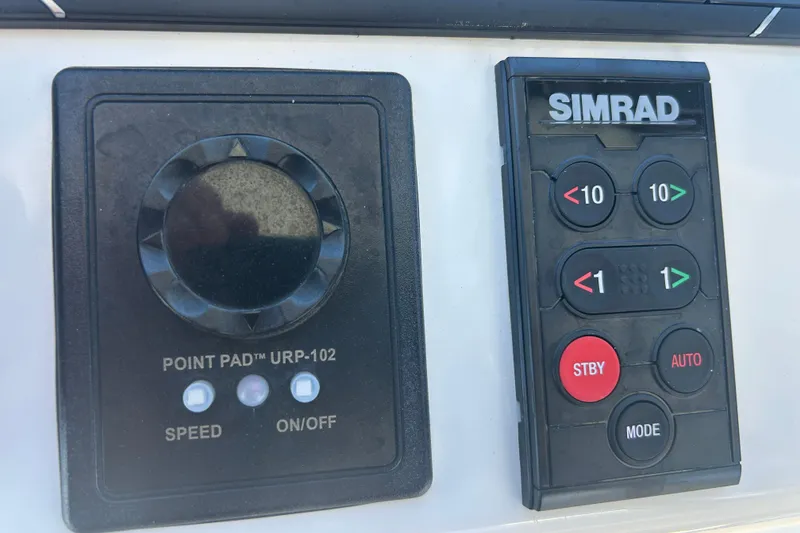 Slide: The Image of Control panel of a 2018 Albemarle 29 Express boat with Simrad and Point Pad URP-102. - 65