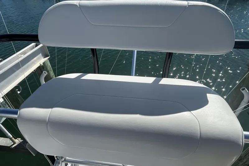Slide: The Image of White cushioned seat on 2018 Albemarle 29 Express boat, overlooking water. - 67