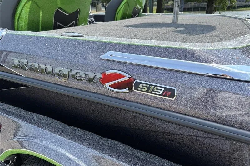 Slide: The Image of 2026 Ranger Z519R Cup-Equipped boat, metallic finish, close-up of logo and seating. - 27