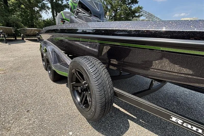 Slide: The Image of 2026 Ranger Z519R Cup-Equipped boat on trailer, showcasing sleek design and black wheels. - 7