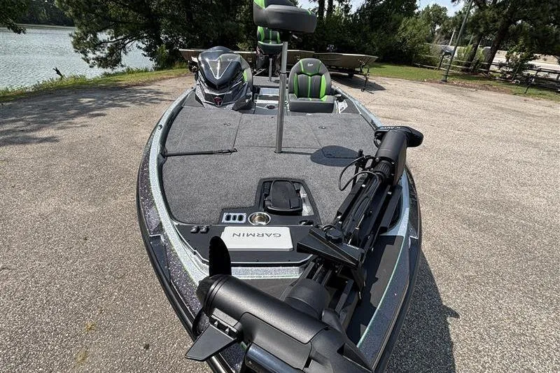 Slide: The Image of 2026 Ranger Z519R Cup-Equipped boat with Garmin equipment, parked near a lake. - 3