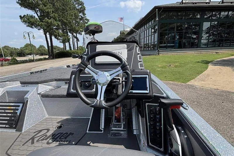 Slide: The Image of 2026 Ranger Z519R Cup-Equipped boat interior with steering wheel and control panel. - 16