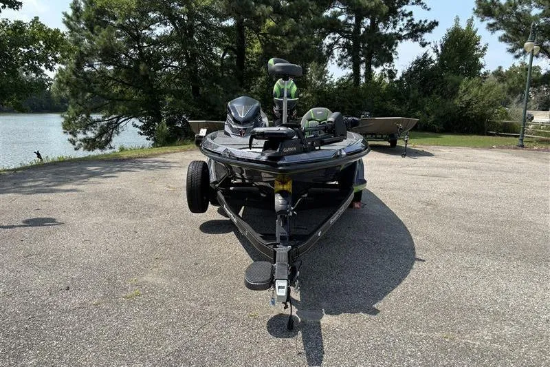 Slide: The Image of 2026 Ranger Z519R Cup-Equipped boat parked near a scenic lake. - 2