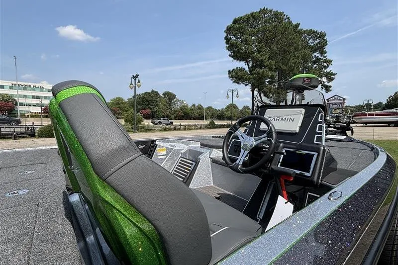 Slide: The Image of 2026 Ranger Z519R Cup-Equipped boat interior with Garmin navigation system and green accents. - 18