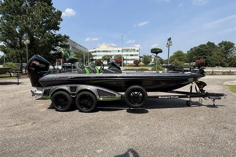 Slide: The Image of 2026 Ranger Z519R Cup-Equipped boat on trailer, parked outdoors under clear sky. - 6