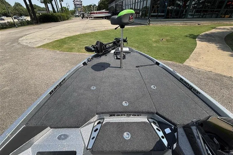 Slide: The Image of 2026 Ranger Z519R Cup-Equipped boat with spacious deck and seating, parked outdoors. - 9