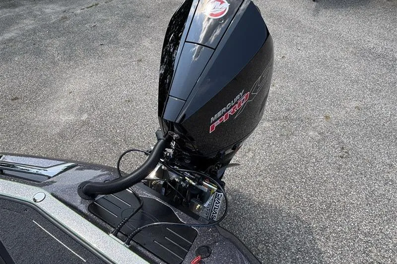 Slide: The Image of 2026 Ranger Z519R Cup-Equipped boat with Mercury Pro engine on pavement. - 24