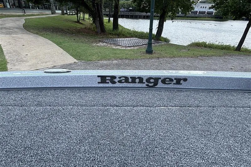 Slide: The Image of 2026 Ranger Z519R Cup-Equipped boat by a scenic lakeside path. - 26