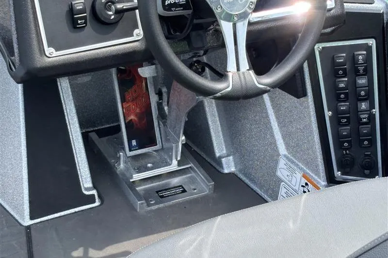 Slide: The Image of 2026 Ranger Z519R Cup-Equipped boat dashboard with steering wheel and control panel. - 17