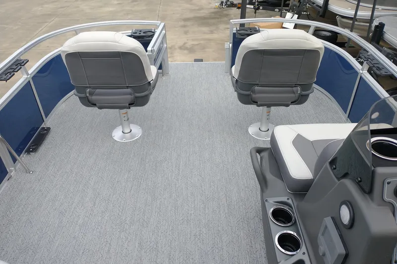 Slide: The Image of 2026 Sun Tracker Bass Buggy 16 XL Select pontoon boat interior with seating and console. - 6