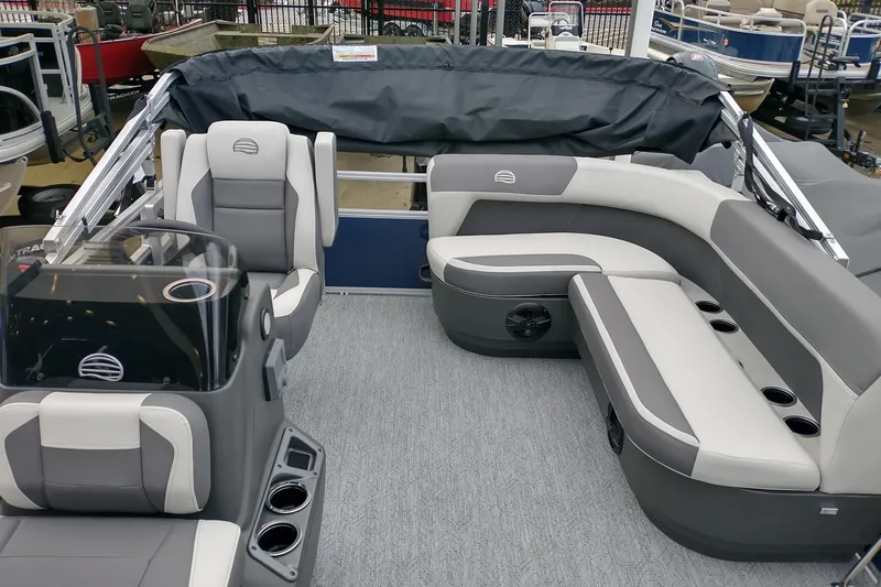 Slide: The Image of 2026 Sun Tracker Bass Buggy 16 XL Select pontoon boat interior with gray seating and console. - 7