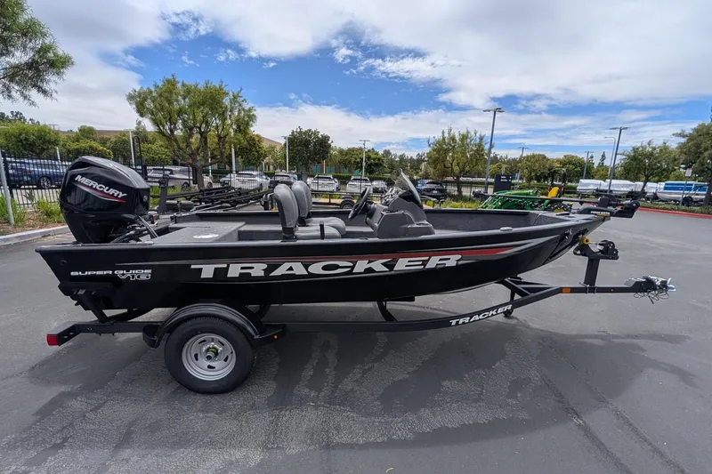 Slide: The Image of 2026 Tracker Super Guide V-16 SC boat with Mercury engine on trailer. - 3