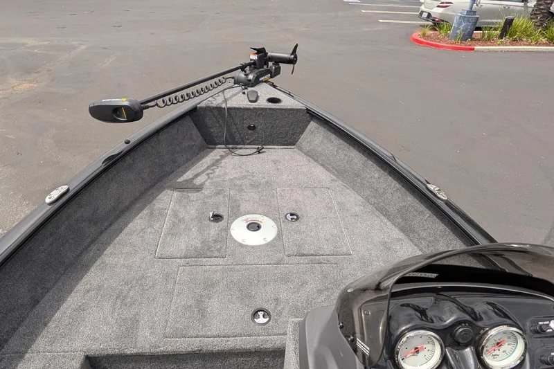 Slide: The Image of 2026 Tracker Super Guide V-16 SC boat interior with trolling motor and dashboard. - 7