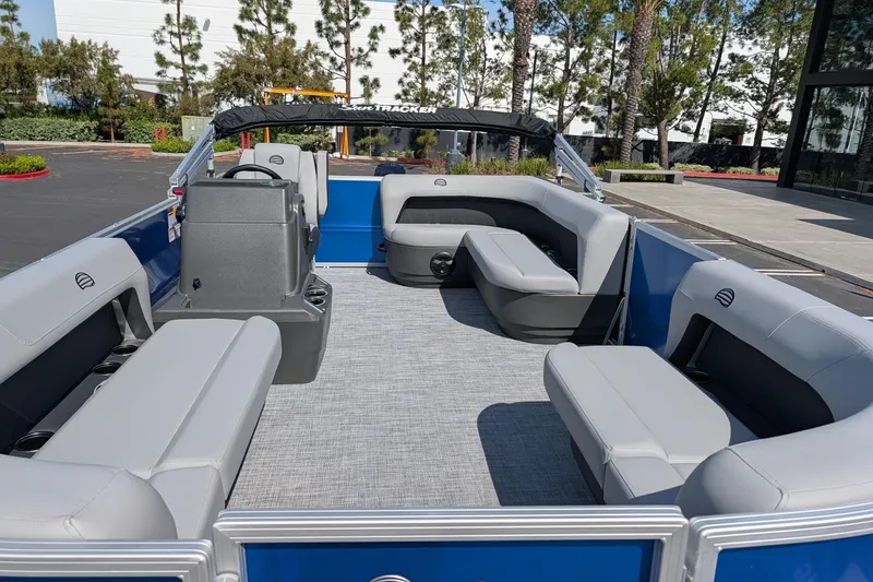 Slide: The Image of 2026 Sun Tracker Party Barge 16 DLX pontoon boat with spacious seating and modern design. - 2