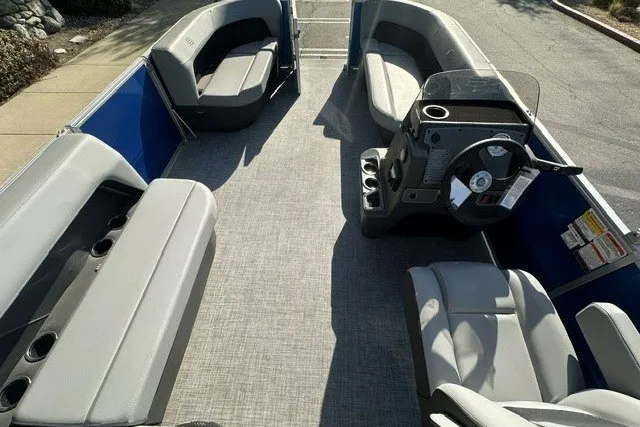 Slide: The Image of 2026 Sun Tracker Party Barge 16 DLX interior with spacious seating and modern helm. - 12