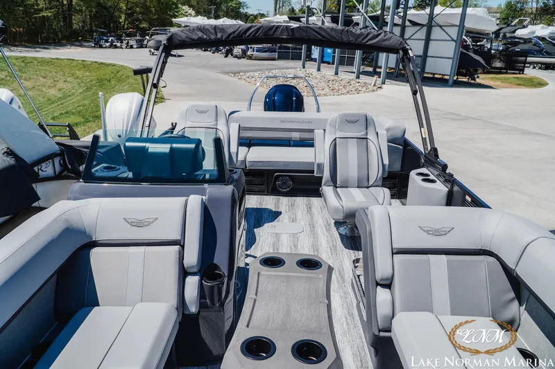 Slide: The Image of 2026 Bennington 23MSB pontoon boat interior with luxurious seating at Lake Norman Marina. - 12