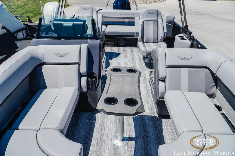 Slide: The Image of 2026 Bennington 23MSB pontoon boat interior with luxurious seating and cup holders. - 13
