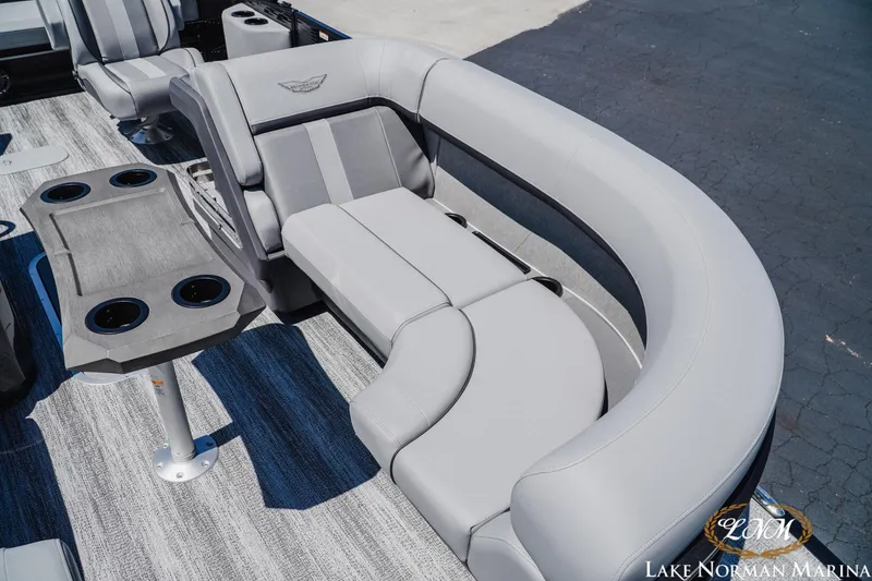 Slide: The Image of 2026 Bennington 23MSB boat interior with gray seating and cup holders. - 15