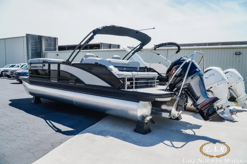 Slide: The Image of 2026 Bennington 23MSB pontoon boat at Lake Norman Marina, featuring Yamaha outboard motor. - 3