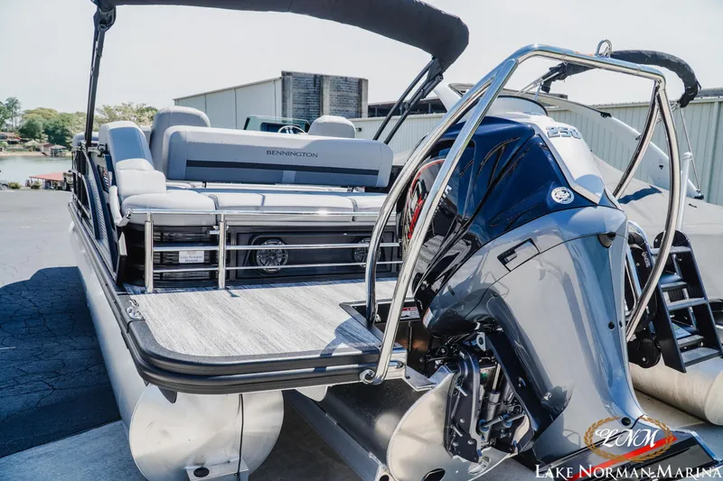 Slide: The Image of 2026 Bennington 23MSB pontoon boat with powerful outboard motor at Lake Norman Marina. - 4