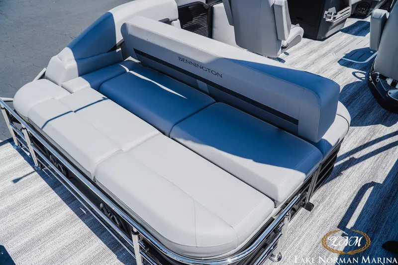 Slide: The Image of 2026 Bennington 23MSB boat interior with plush seating at Lake Norman Marina. - 6