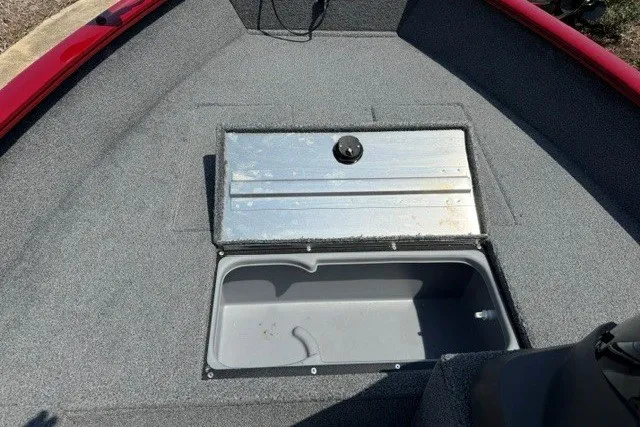 Slide: The Image of 2026 Tracker Super Guide V-16 SC boat storage compartment with open lid, showcasing interior space. - 10